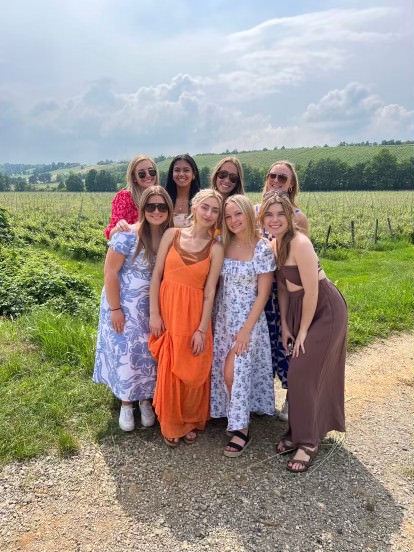 Emma with friends near a field in Italy.