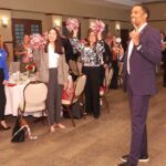 one male speaking to an luncheon audience