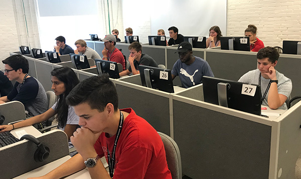 Poole College's first-year students are completing an online self assessment at one of NC State's computer labs as part of their orientation.