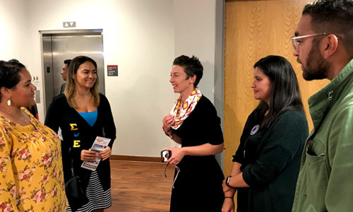 Dakota Lowry, Chelsea Locklear and Tayah Butler, Poole College Diversity and Inclusion director, talked with Locklear's friends after the unveiling of the display at Poole College.