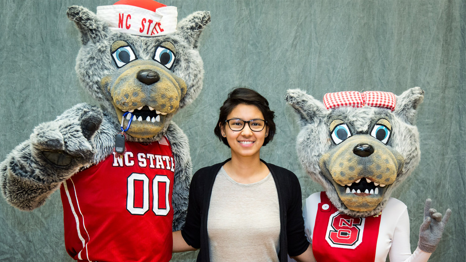 Photo of Soumya Nadabar with Mr. and Mrs. Wuf at NC State.