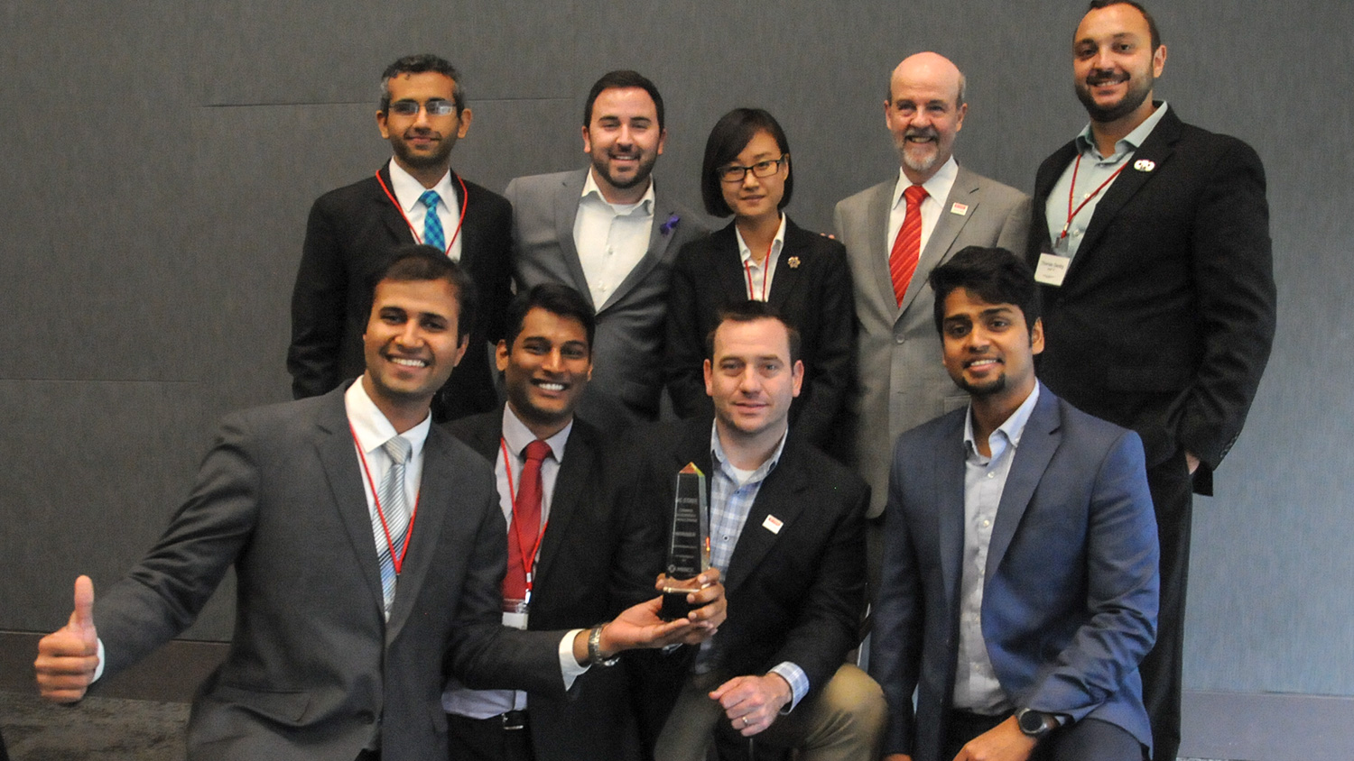 Photo of First place Boston University Questrom School of Business MBA students with their NC State Jenkins MBA 'assist' team