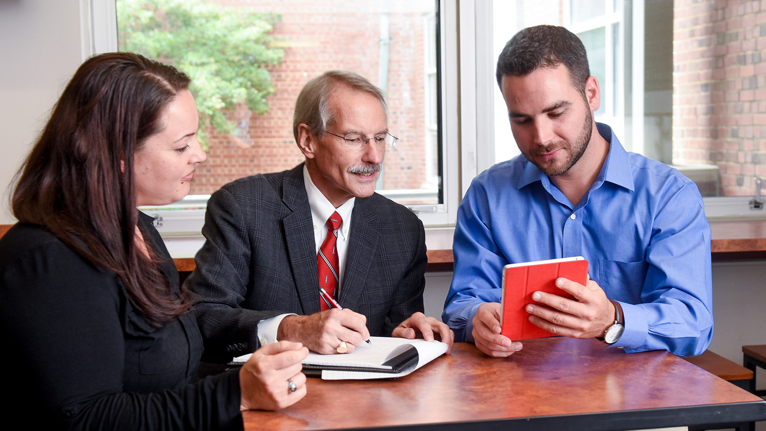 Scott Showalter with Master of Accounting students in Nelson Hall Student Commons