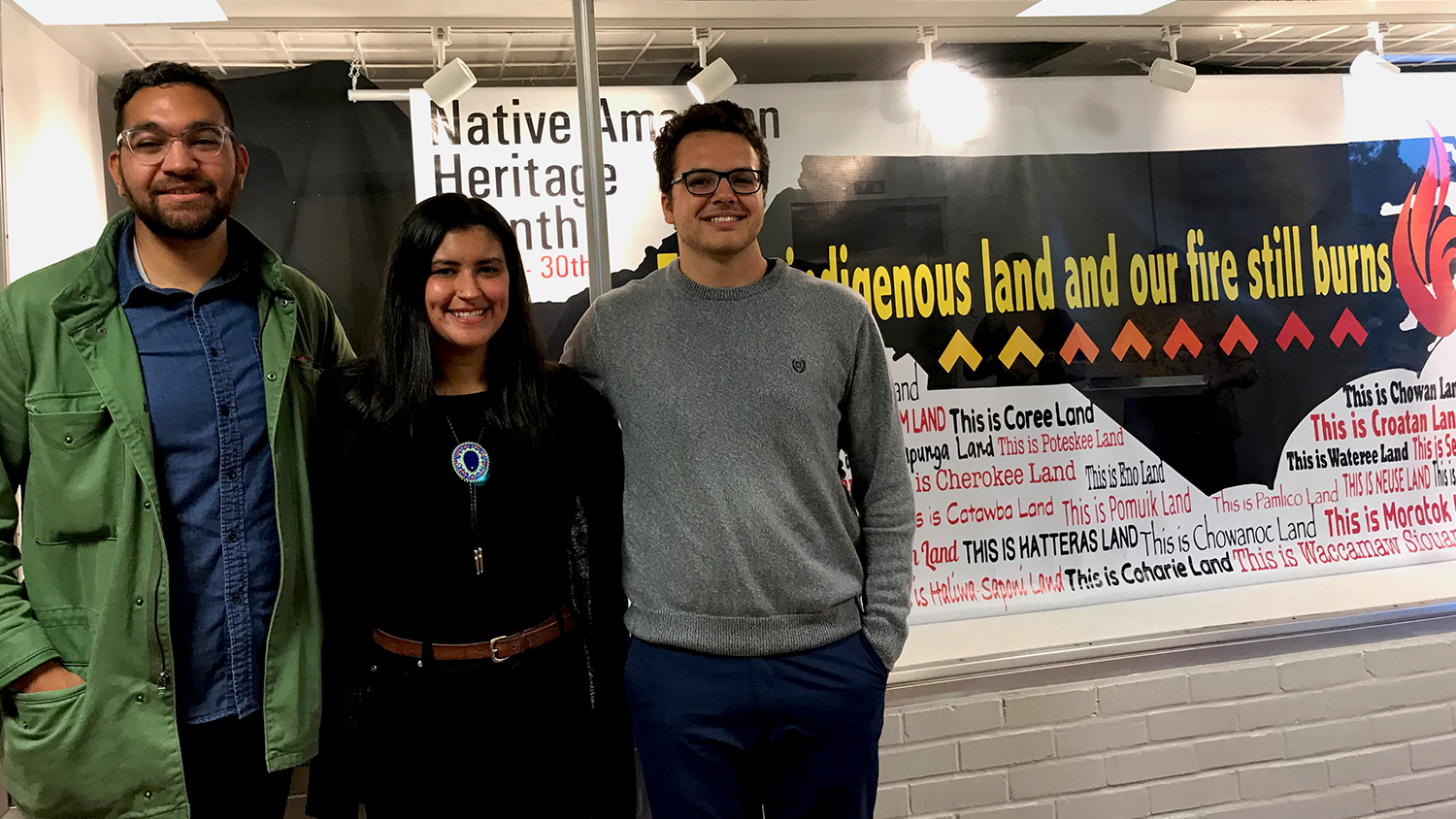 Dakota Lowry, Chelsea Locklear and Belton Moore at Poole at Poole College following the unveiling of the Native American Heritage display created by Locklear