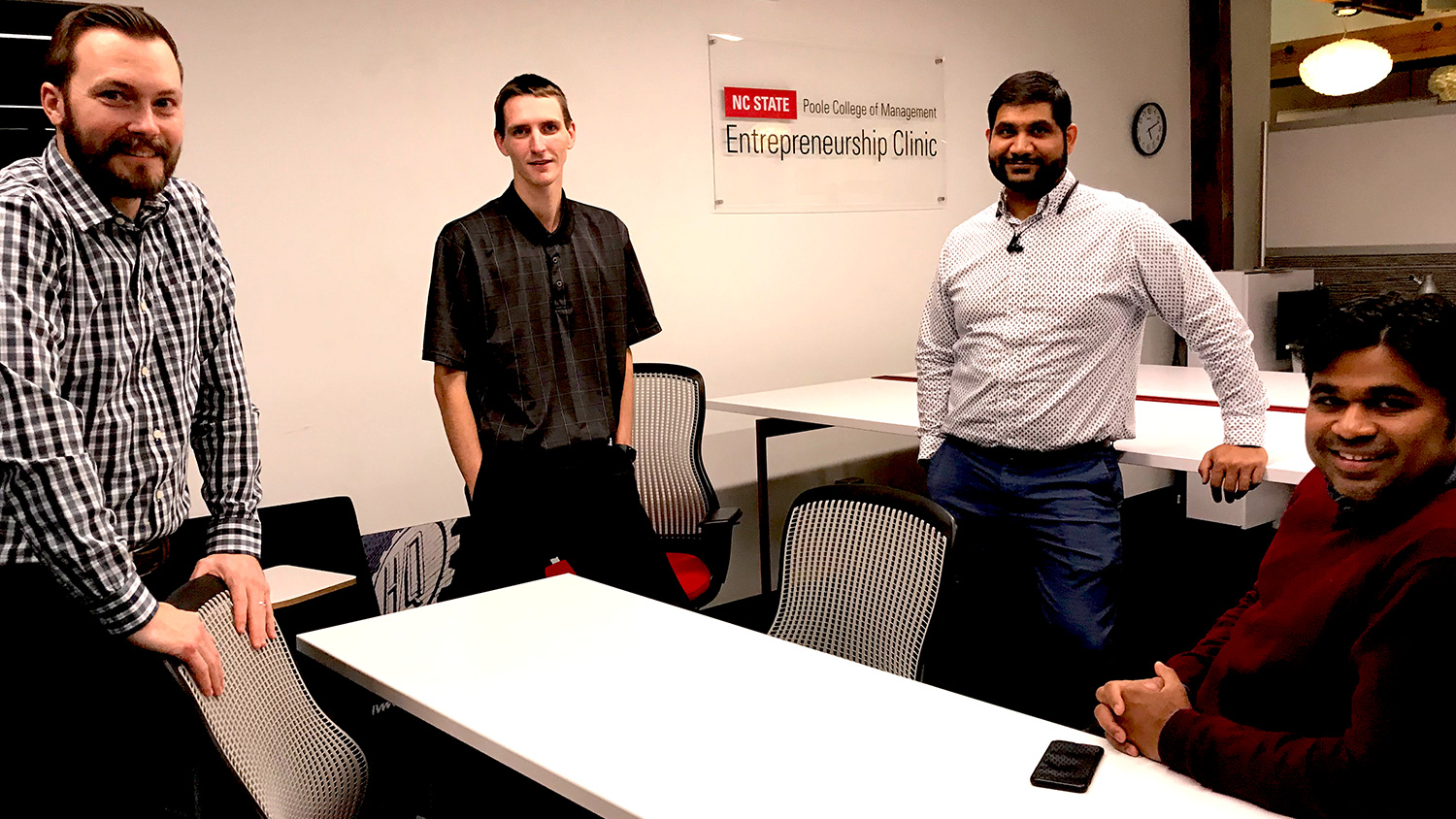 MBA team members meeting at the NC State Entrepreneurship Clinic, left to right: Cody Shipman, Taylor Utecht, Shyam Ram, and Krupa Stephen Gadde