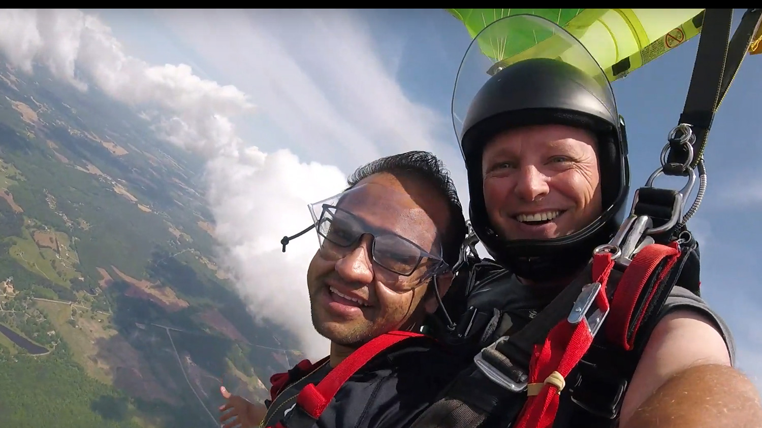 Sahir Patel, in the air with his Triangle Skydiving tandem jump partner, Joe Jones.