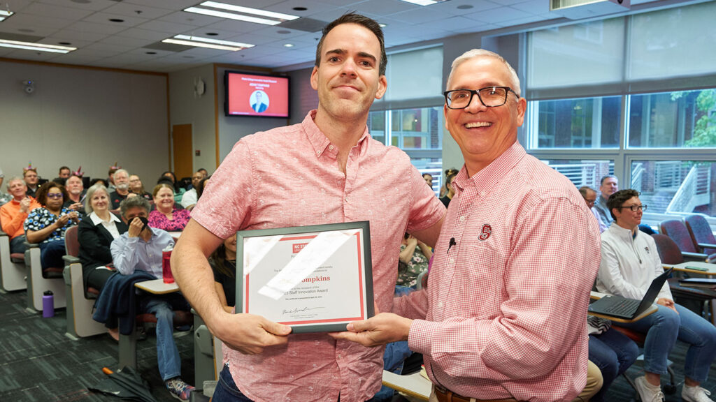 Adam Tompkins (left) with Dean Buckless at the spring 2023 college meeting.
