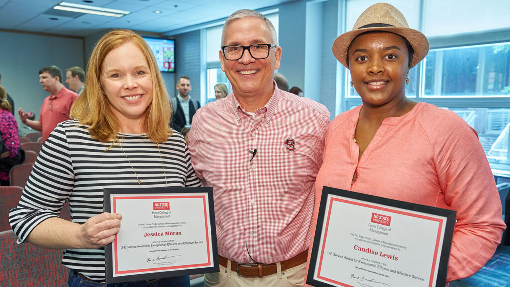Jessica Moran (left) and Candise Lewis with Dean Buckless at the spring 2023 college meeting