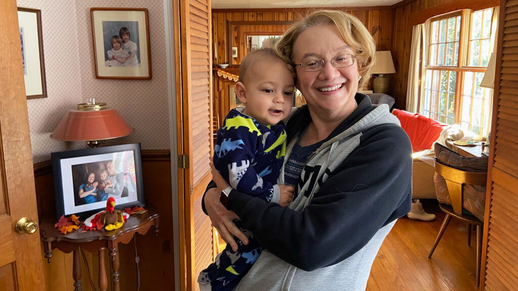 Janet Rakes holding one of her grandchildren. 