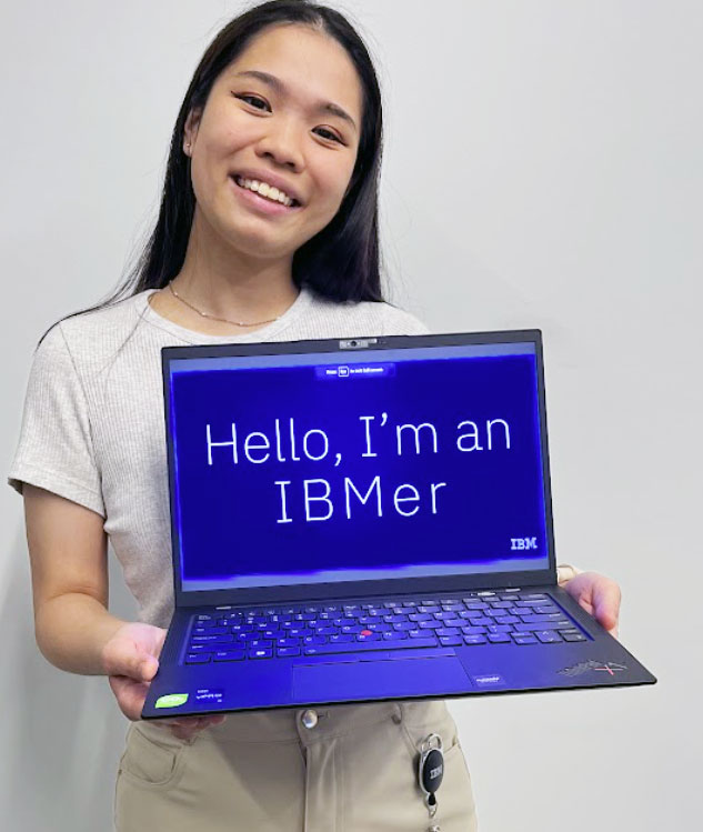 Kelly Chin holding IBM laptop