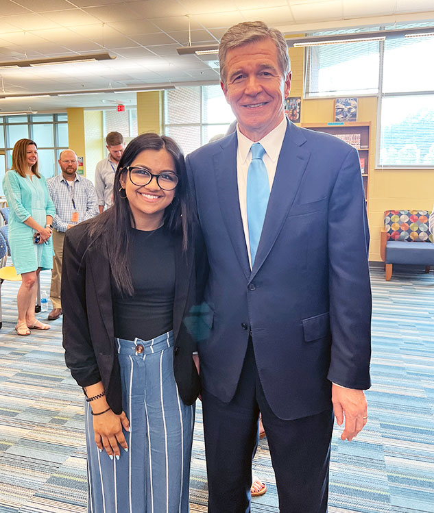 Siyona Shah with N.C. Gov. Roy Cooper at an event during her summer internship. 