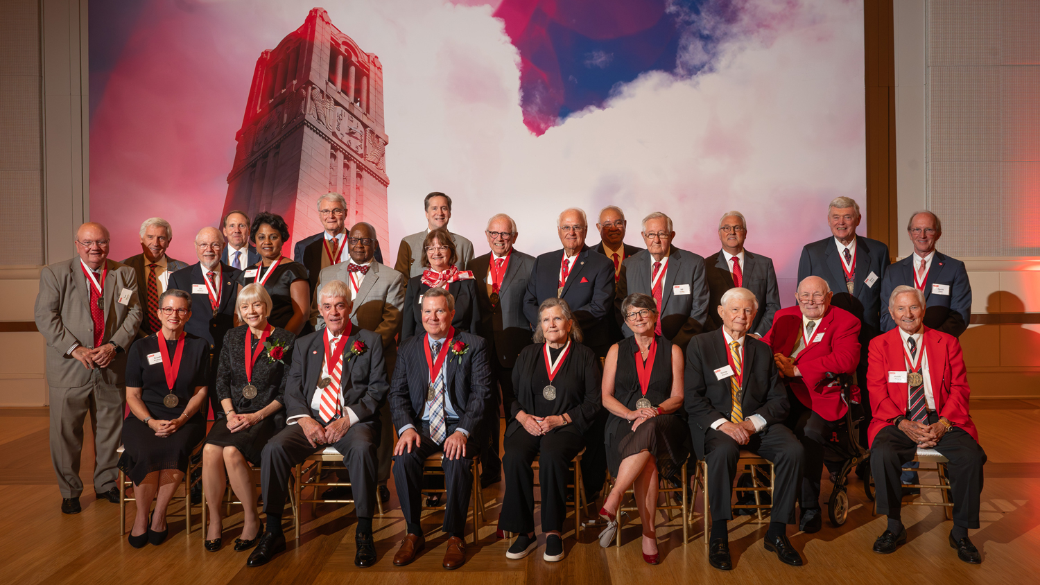 Cathy Sigal, Tom Stafford and Mike Constantino — second, third and fourth from the left on the front row, respectively — pose for a photo with past Watauga Medal recipients, members of the NC State University Foundation’s Board of Trustees and other university leaders at the 2023 ceremony. Photo by Marc Hall