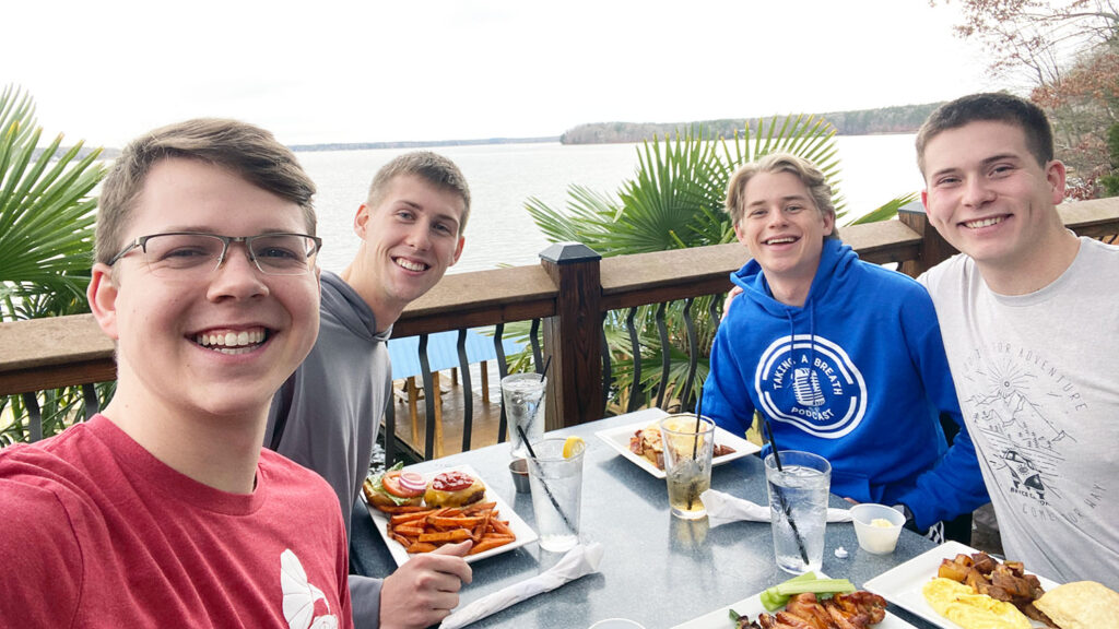 group enjoying a waterfront meal