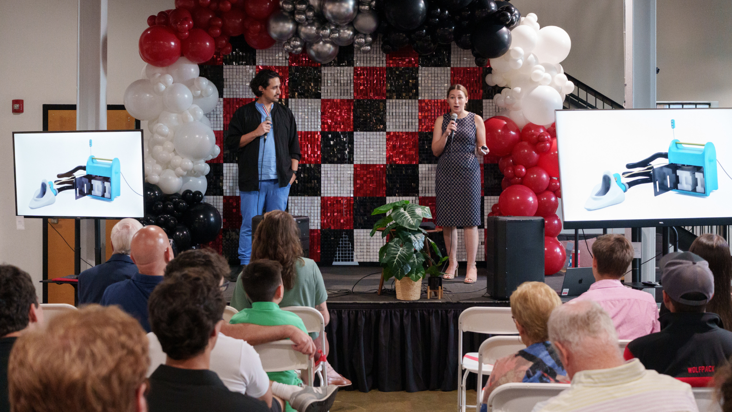 Startup founders pitch to audience at ALA Demo Day