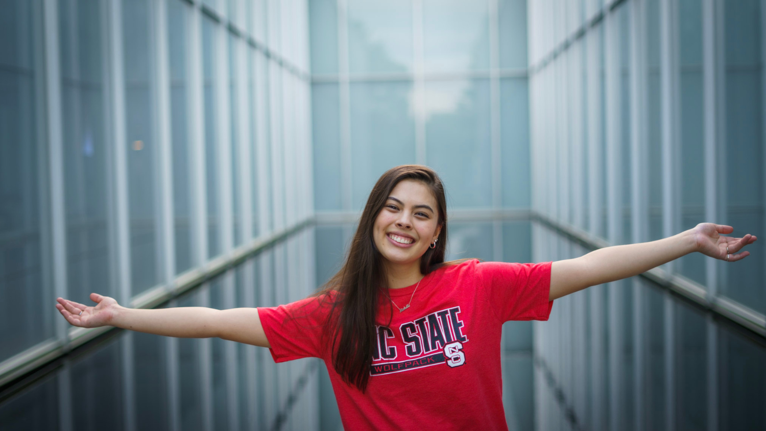 Michelle McMorris smiles and extends her arms