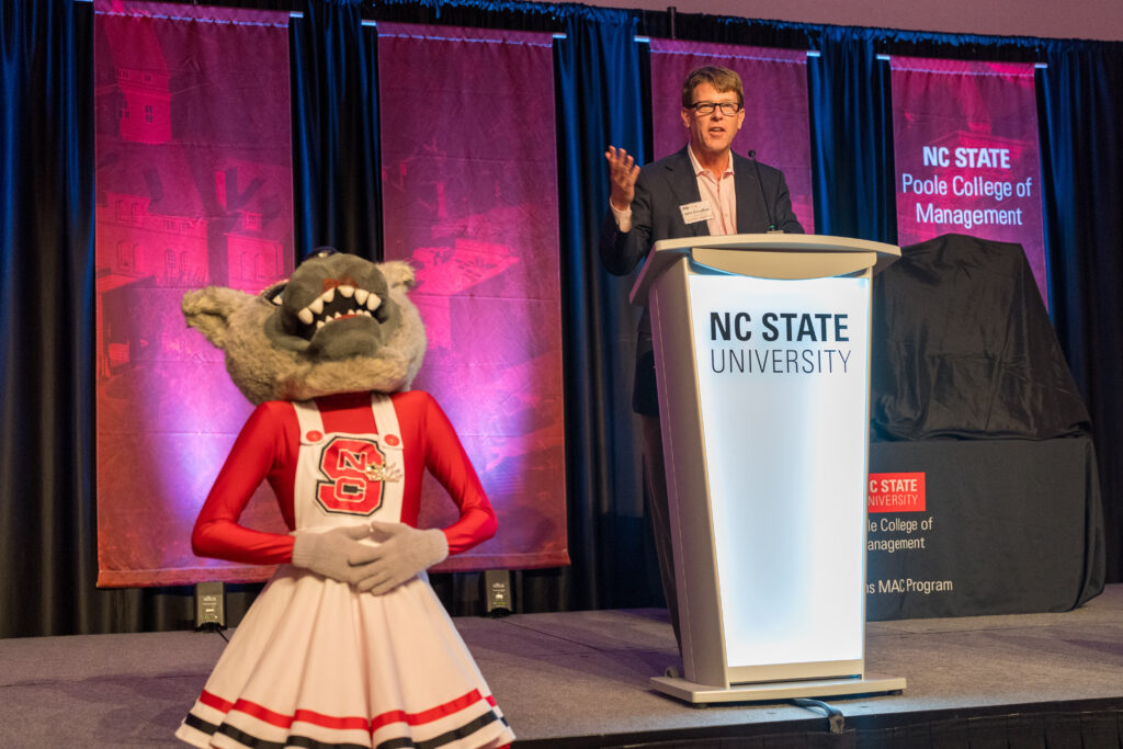 Justin Broadfood gives speech next to Mrs. Wuf