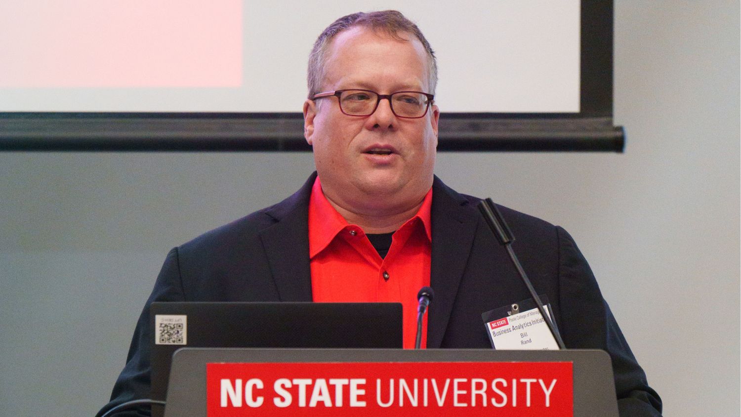 Bill Rand at a podium