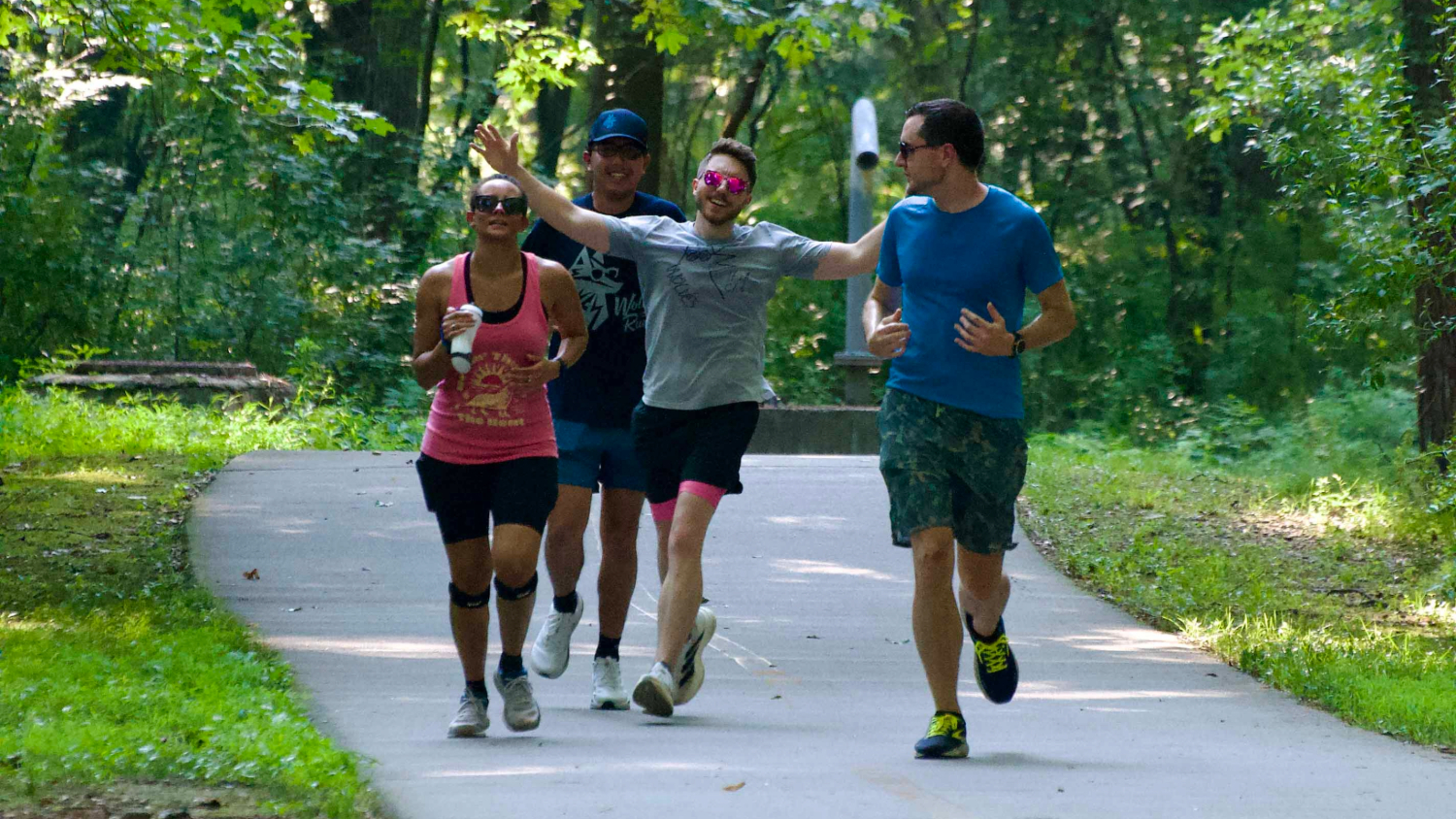 James Hudgens, a visual arts specialist for Campus Enterprises, runs with colleagues.