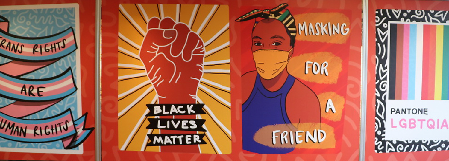 A mural with an image of a fist and the words 'Black Lives Matter' next to an image of a person wearing a mask that says 'Masking for a friend' with other images on each side