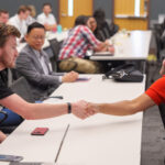 studnets shake hands
