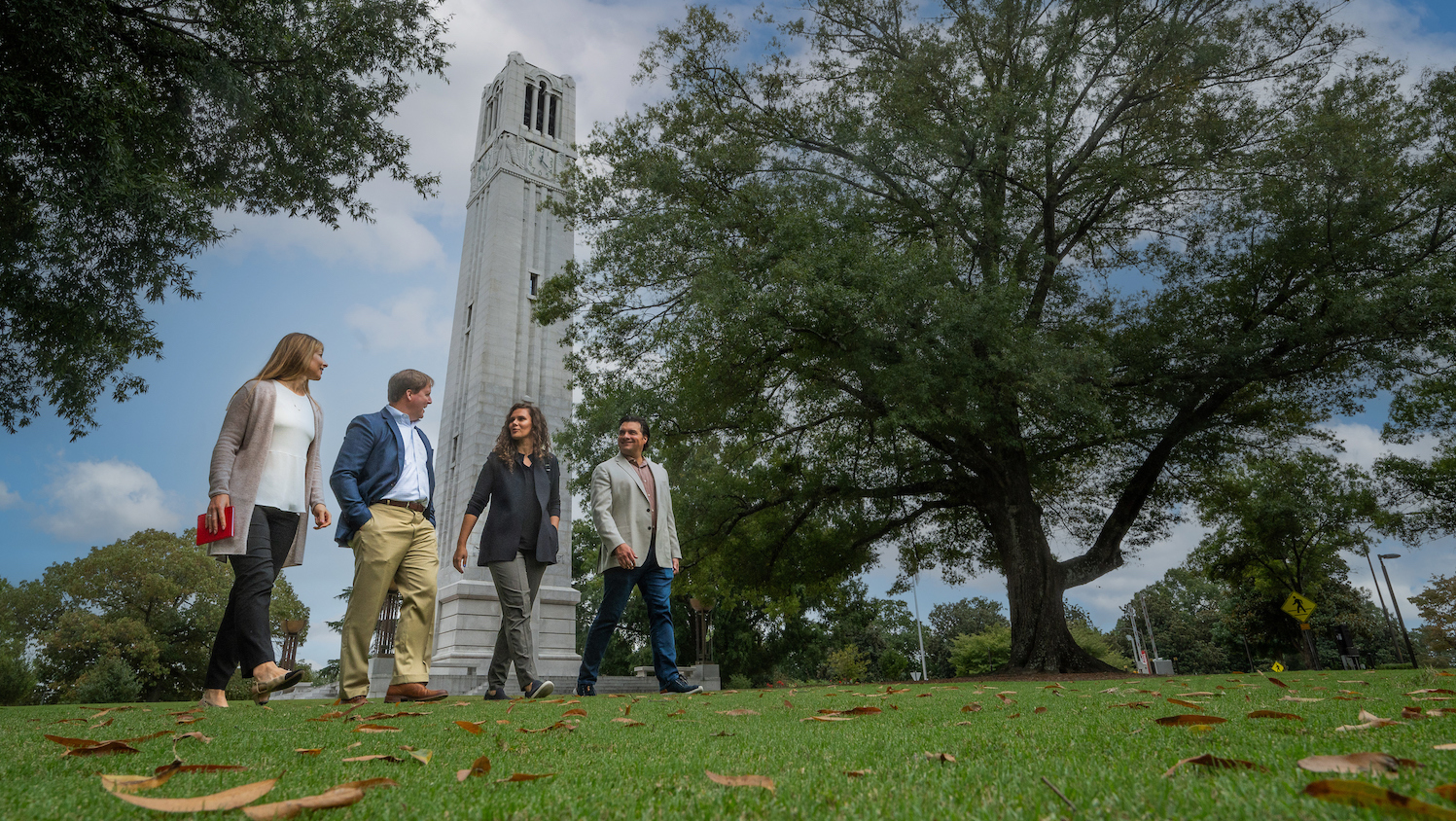 Poole Graduate Students Near Bell Tower
