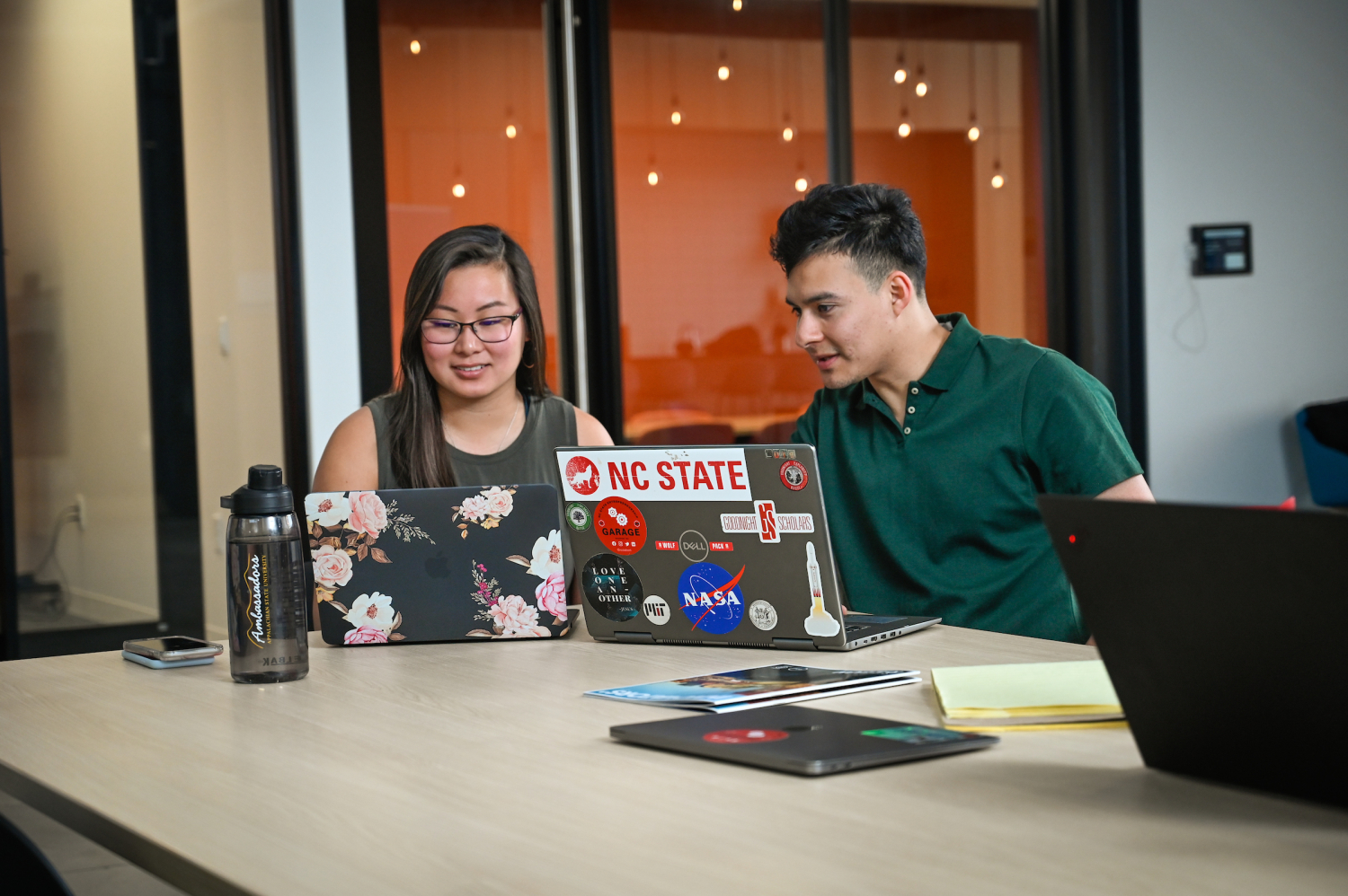 2 Students work in the Entrepreneurship Clinic on Centennial Campus. Photo by Marc Hall