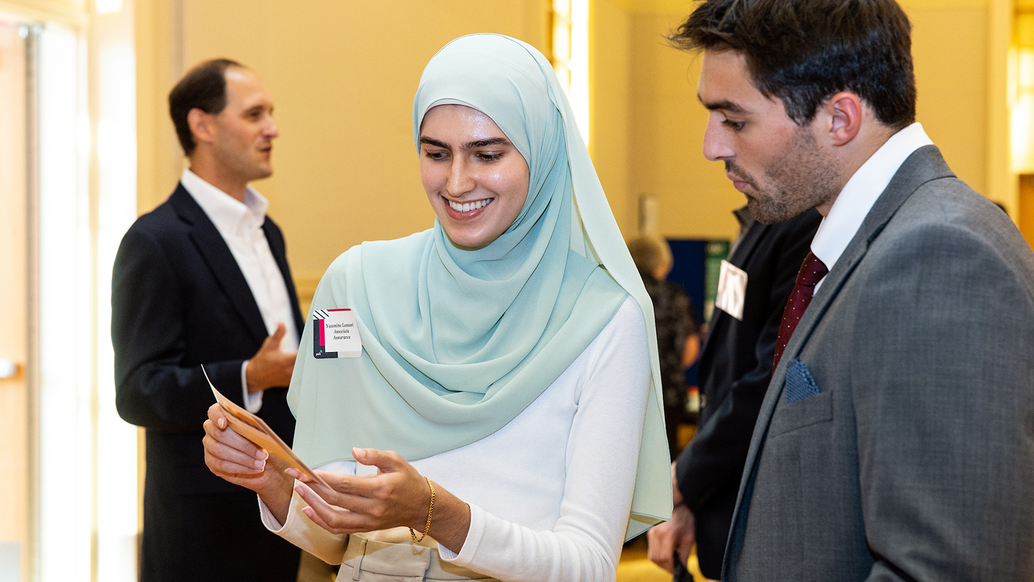 A Poole College student meets with recruiters at a job fair.