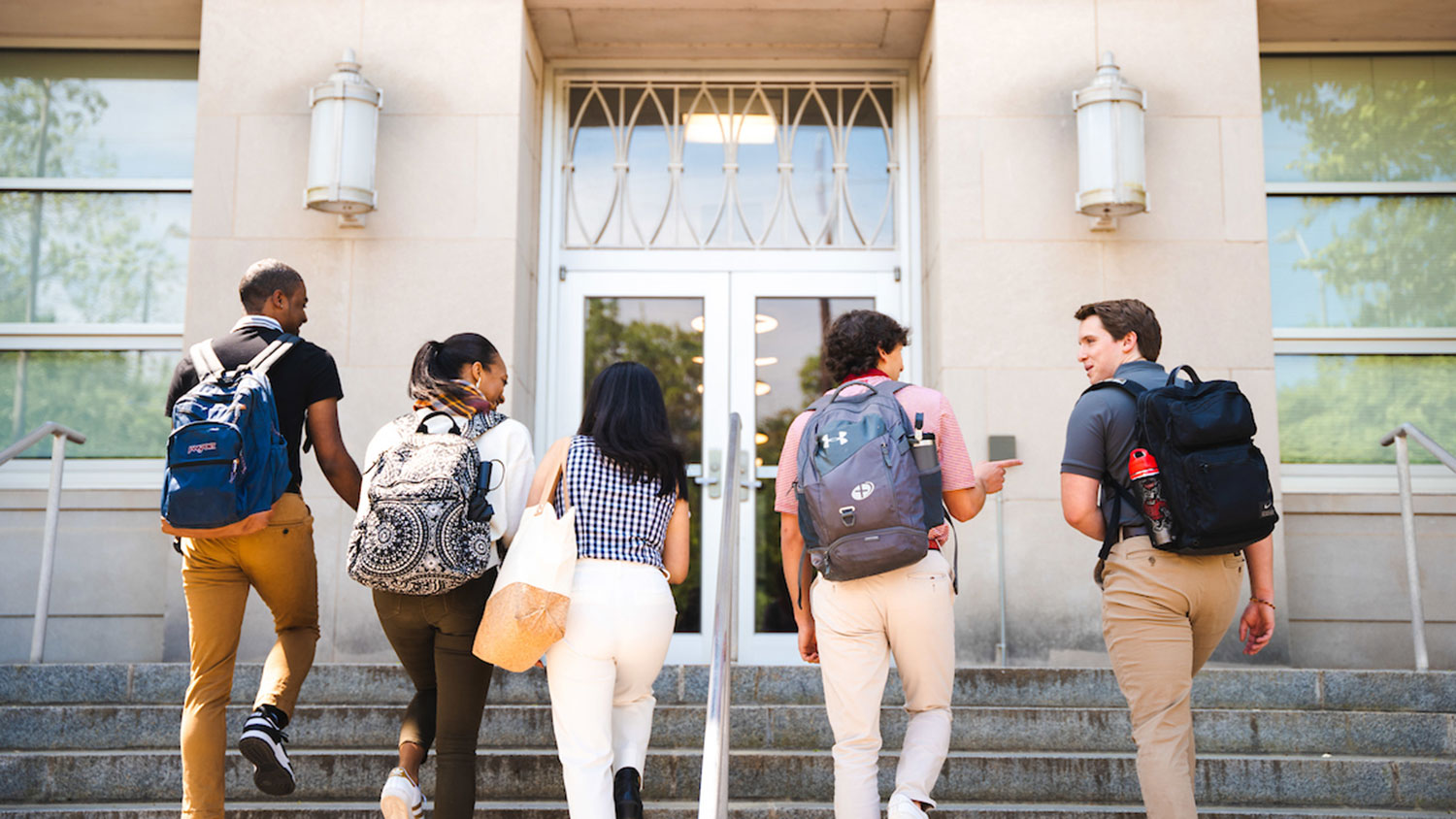 students on the front steps of Nelson Hall