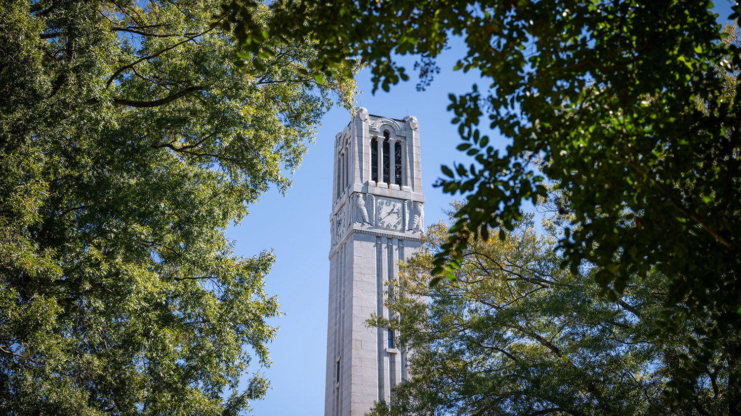 The Memorial Belltower in the midst of fall greenery.